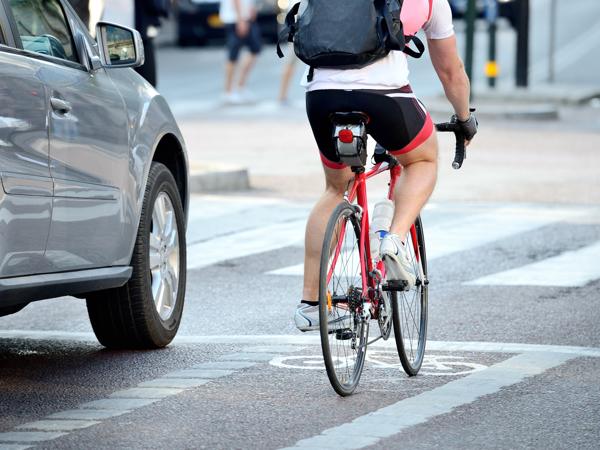 Cyclist in city traffic