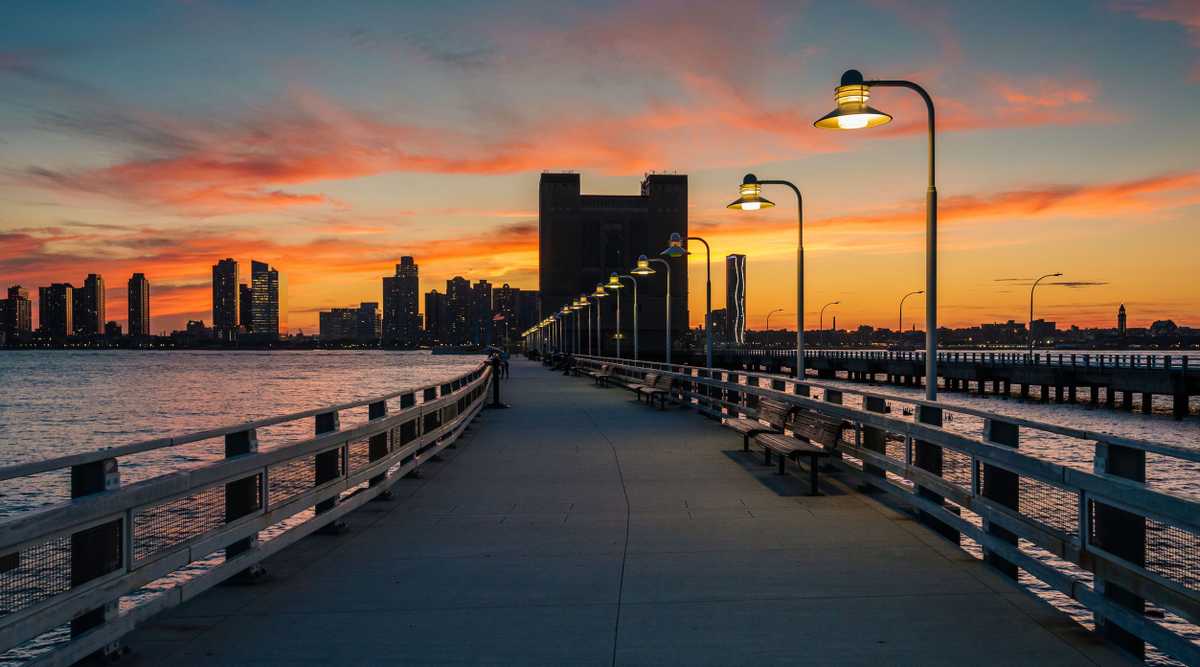 Sunset over Pier 34 and Jersey City, in Manhattan, New York City